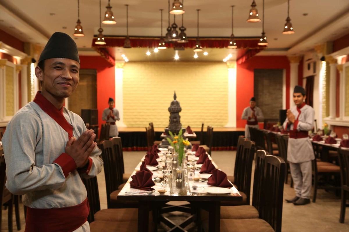 The main dining hall at Utsav, laid for a formal evening service