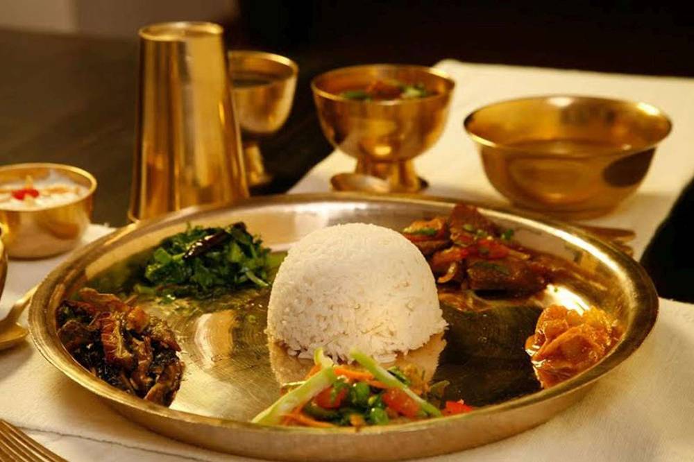 A traditional Nepali dinner set plated on brass